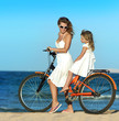 woman and girl  on the beach