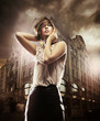 Fine art photo of a beautiful woman in front of a building