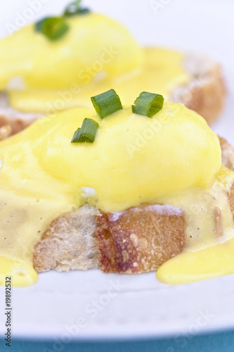 Photo: Eggs Benedict on toast with creamy hollandaise sauce. Eggs Benedict on toast with creamy hollandaise sauce.