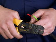 wire stripper   in the hands of worker