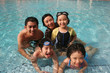 Happy family in the pool