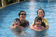 Photo: Mother and kids in the pool Mother and kids in the pool