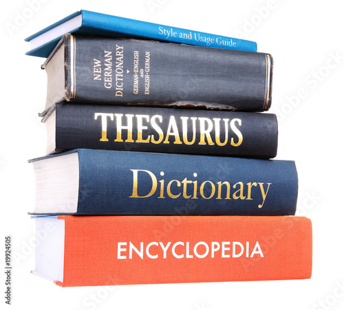 Photo: A pile of reference books isolated against a white background A pile of reference books isolated against a white background
