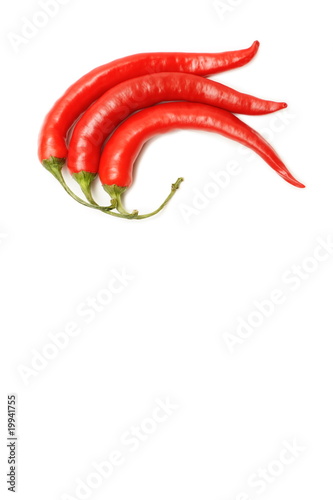 Three red chilli peppers isolated on white background