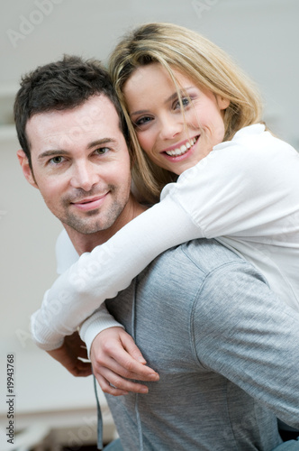 Photo: Young couple piggyback Young couple piggyback