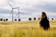 Woman in the barley with windmills Woman in the barley with windmills