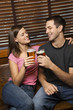 Foto: Couple Toasting Their Beers Couple Toasting Their Beers