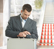 Businessman checking time