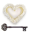 Wedding heart with rusty key. Isolated over white background