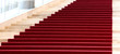 Stairs covered with red carpet
