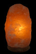 Orange salt lamp on black background Orange salt lamp on black background