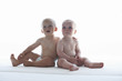 Babies sitting on a sofa