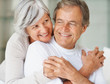 Cute elderly couple hugging each other