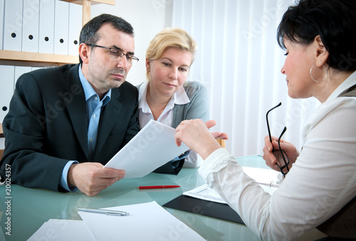 Photo: couple meeting with agent couple meeting with agent