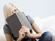 Laughing Woman Holding a Book