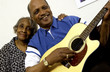 African American couple with man playing guitar African American couple with man playing guitar