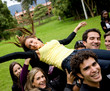 People lifting a woman