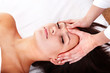 Beautiful  girl and beautician. Facial massage.