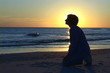 Kneeling At The Beach