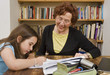 Foto: senior halping child doing homework senior halping child doing homework