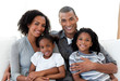 Foto: Loving family sitting on the sofa together Loving family sitting on the sofa together