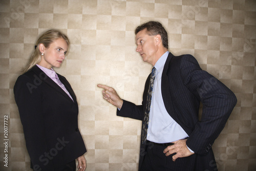 Photo: Businessman Reprimanding Businesswoman Businessman Reprimanding Businesswoman
