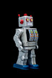 Toy robot on black background
