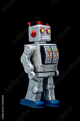 Foto: Toy robot on black background Toy robot on black background
