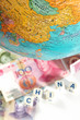 Globe and currencies. Business concept.