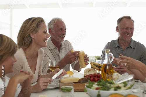 Photo: Happy family at a lunch table Happy family at a lunch table