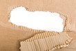 Corrugated cardboard sheet torn