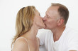 Middle aged couple kissing Middle aged couple kissing