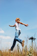 Young woman running on sunny nature