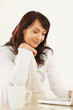 Cute young female using a laptop while at home