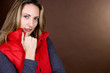 Portrait of a mid adult woman wearing a red gilet
