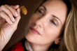 A mid adult woman looking at an acorn