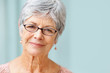 Photo: Closeup of a beautiful retired senior woman smiling Closeup of a beautiful retired senior woman smiling