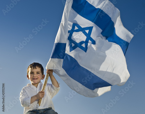 Photo: young boy holding the Israeli flag young boy holding the Israeli flag