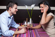 Young couple drinking wine and flirting Young couple drinking wine and flirting