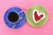 Cake heart and cup of tea on the table