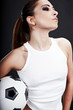 Sexy soccer player, woman on playing field
