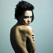 Nude sensual woman with predatory sight