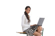 Indian college student woman with computer sitting on desk with