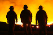 A silhouette of three fire fighters A silhouette of three fire fighters