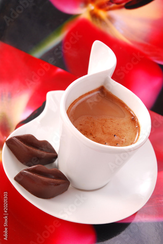 Photo: coffee with red chocolate lips coffee with red chocolate lips