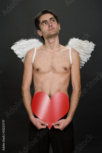 Photo: Glamour man with white wings. Glamour man with white wings.