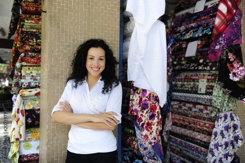 Photo: happy owner of a fabric store happy owner of a fabric store