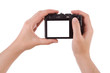 Hand photographing with a digital camera isolated on white Hand photographing with a digital camera isolated on white