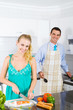 young newlyweds cooking