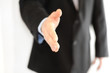 Photo: Business man giving a hand shake Business man giving a hand shake